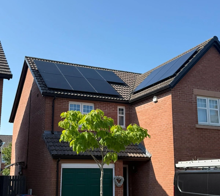 Home with solar panels and an EV charger